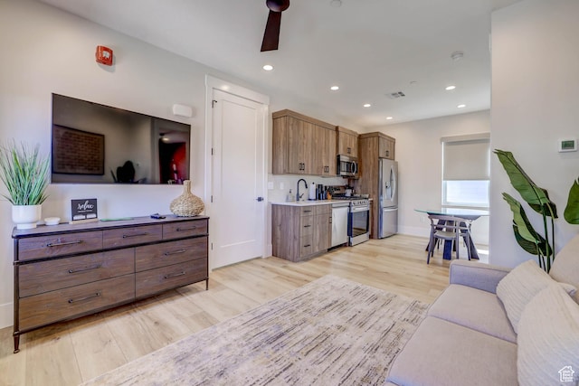 4971 S Cattail Way, Washington, UT 84780 - living room with light wood-type flooring, baseboards, recessed lighting, visible vents, and ceiling fan