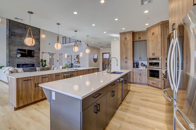 4971 S Cattail Way, Washington, UT 84780 - kitchen featuring a large island, open floor plan, visible vents, stainless steel appliances, and a sink