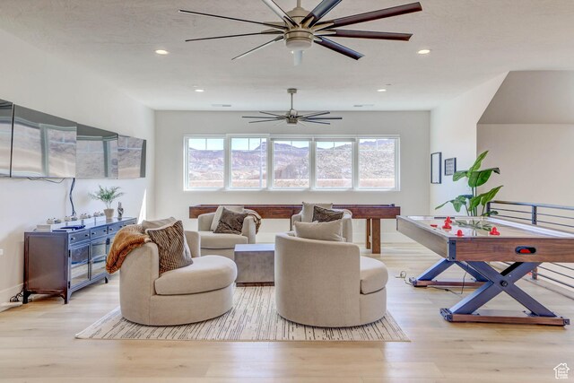 4971 S Cattail Way, Washington, UT 84780 - living area with plenty of natural light, ceiling fan, and wood finished floors