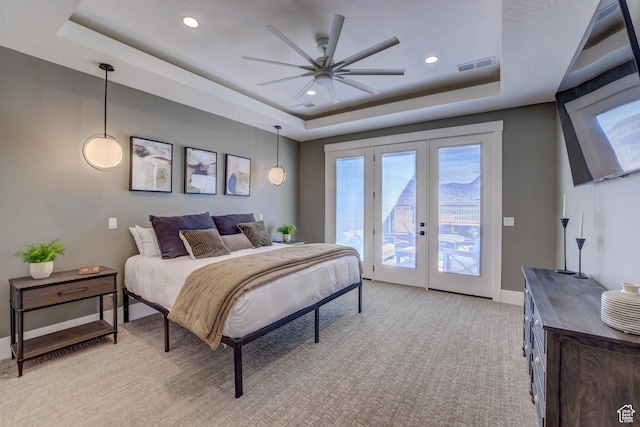 4971 S Cattail Way, Washington, UT 84780 - bedroom with visible vents, multiple windows, a tray ceiling, access to exterior, and light colored carpet
