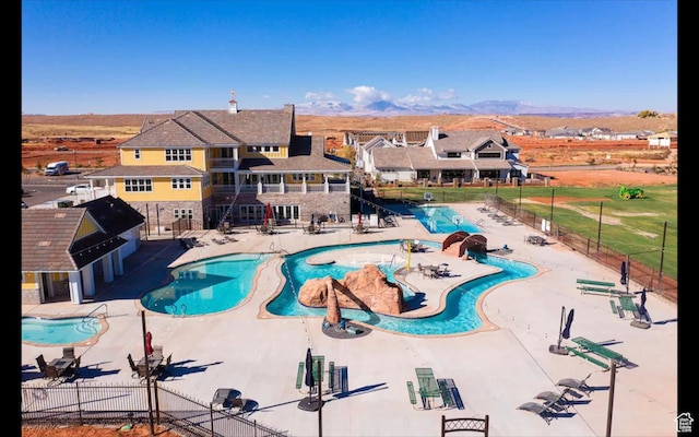 4971 S Cattail Way, Washington, UT 84780 - community pool with a patio, fence, and a mountain view
