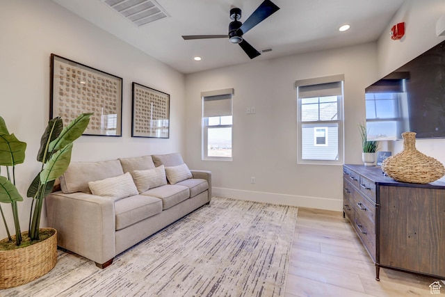 4971 S Cattail Way, Washington, UT 84780 - living area with light wood-type flooring, ceiling fan, baseboards, and visible vents