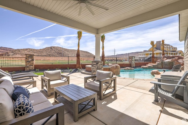 4971 S Cattail Way, Washington, UT 84780 - view of patio with ceiling fan, outdoor lounge area, fence, a mountain view, and a fenced in pool