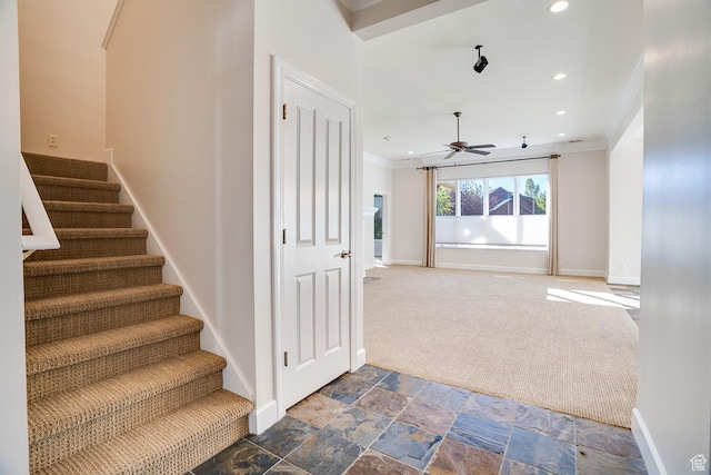 stairs featuring ceiling fan, baseboards, ornamental molding, and recessed lighting