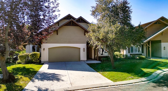 view of front of home with concrete driveway, an attached garage, stucco siding, and a front yard