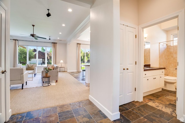 49 W Oberland Ct, Midway, UT 84049 - hall featuring plenty of natural light, baseboards, crown molding, stone tile flooring, and recessed lighting