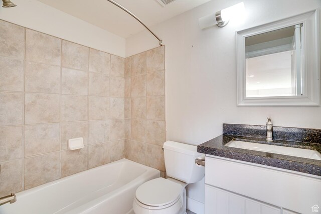 full bathroom with visible vents, shower / washtub combination, vanity, and toilet