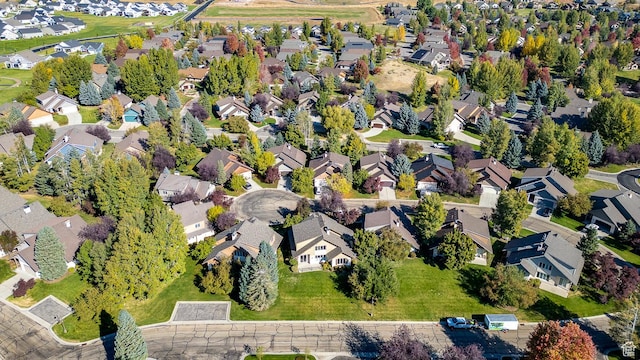 birds eye view of property with a residential view