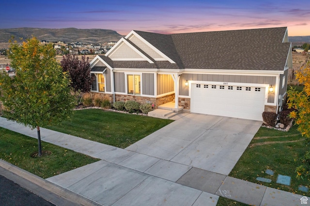 1007 S Weathervane Way, Heber City, UT 84032 - view of front of property featuring roof with shingles, a front lawn, stone siding, a garage, and board and batten siding