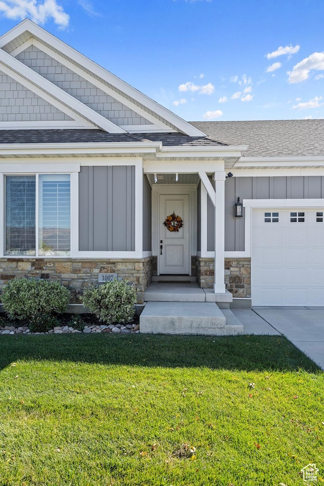 1007 S Weathervane Way, Heber City, UT 84032 - view of front of property featuring board and batten siding, roof with shingles, stone siding, and a garage