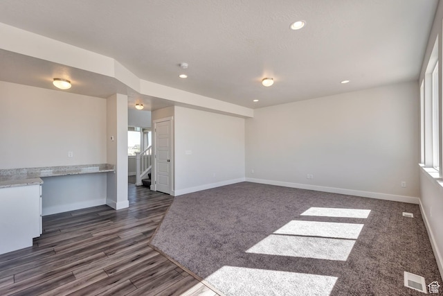 1777 S 3725th St W Unit 107, Taylor, UT 84401 - unfurnished living room featuring baseboards, stairway, recessed lighting, and dark wood-style floors