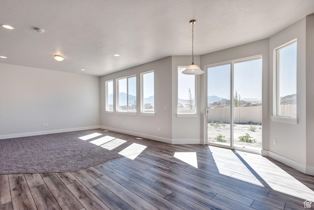 1777 S 3725th St W Unit 107, Taylor, UT 84401 - spare room with baseboards, wood finished floors, recessed lighting, a textured ceiling, and a smoke detector