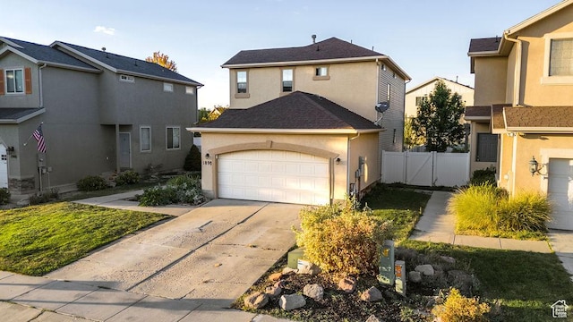 1898 W Pointe Meadow Loop, Lehi, UT 84043 - traditional-style home featuring an attached garage, driveway, fence, and stucco siding