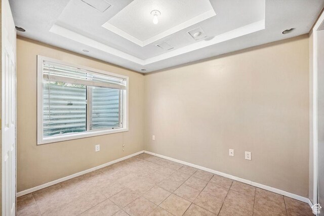 1898 W Pointe Meadow Loop, Lehi, UT 84043 - spare room featuring a raised ceiling, baseboards, and light tile patterned flooring