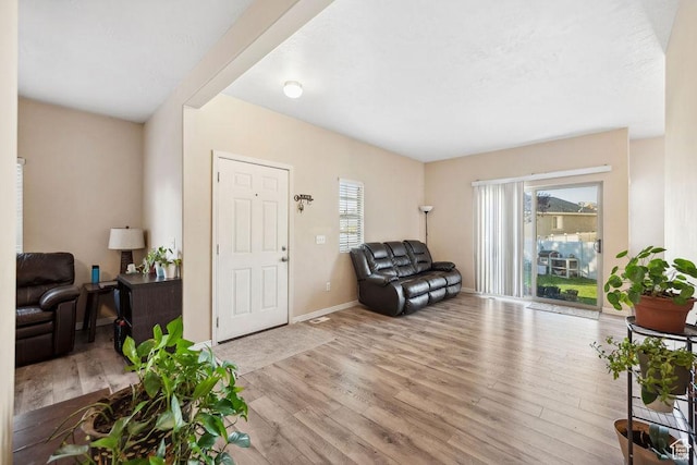 1898 W Pointe Meadow Loop, Lehi, UT 84043 - living area with light wood-style flooring and baseboards