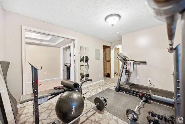 1898 W Pointe Meadow Loop, Lehi, UT 84043 - workout room featuring marble look tile flooring, electric panel, baseboards, and a textured ceiling