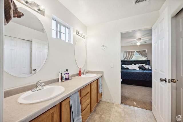 1898 W Pointe Meadow Loop, Lehi, UT 84043 - bathroom with connected bathroom, healthy amount of natural light, double vanity, and a ceiling fan