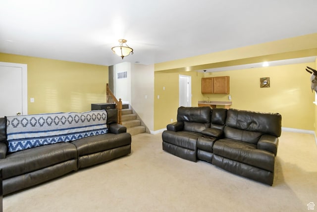245 N 700 E, Richfield, UT 84701 - living area featuring visible vents, baseboards, carpet, and stairway