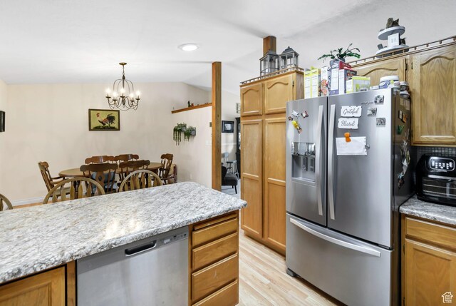 245 N 700 E, Richfield, UT 84701 - kitchen featuring pendant lighting, an inviting chandelier, light wood-style floors, and stainless steel appliances