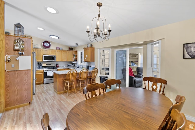 245 N 700 E, Richfield, UT 84701 - dining space with recessed lighting, light wood finished floors, a chandelier, and vaulted ceiling