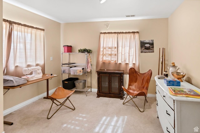 245 N 700 E, Richfield, UT 84701 - living area featuring visible vents, baseboards, and light carpet