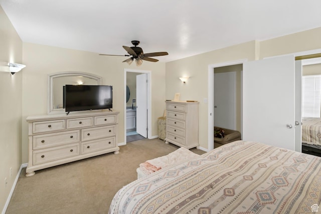 245 N 700 E, Richfield, UT 84701 - bedroom featuring baseboards, a ceiling fan, connected bathroom, and light carpet