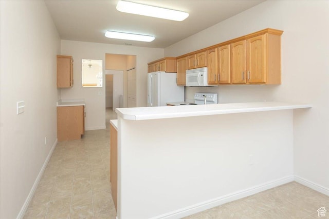 2896 W Abbey Springs Cir S, West Jordan, UT 84084 - kitchen with a peninsula, white appliances, light countertops, and baseboards