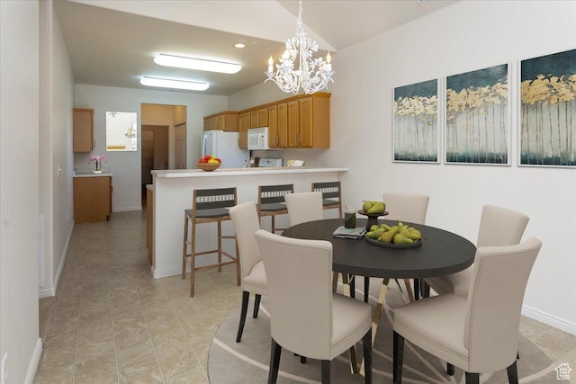 2896 W Abbey Springs Cir S, West Jordan, UT 84084 - dining space featuring baseboards and an inviting chandelier