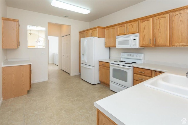 2896 W Abbey Springs Cir S, West Jordan, UT 84084 - kitchen featuring a sink, light floors, visible vents, white appliances, and light countertops