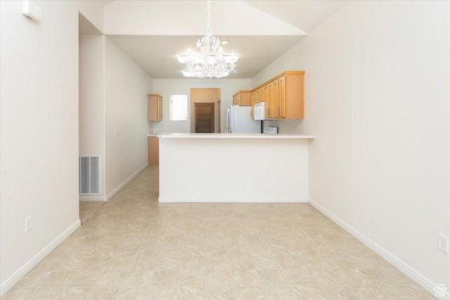 2896 W Abbey Springs Cir S, West Jordan, UT 84084 - kitchen with a notable chandelier, visible vents, white appliances, light countertops, and vaulted ceiling
