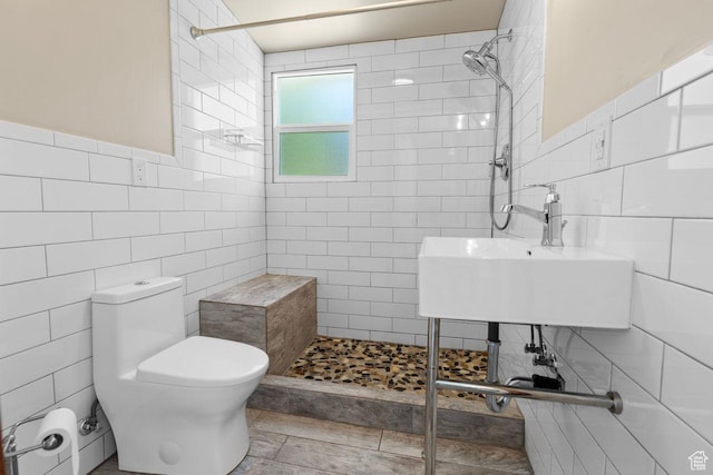 327 E Coatsville Ave S, Salt Lake City, UT 84115 - bathroom with tile walls, tiled shower, toilet, a sink, and pet washing area