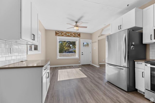 327 E Coatsville Ave S, Salt Lake City, UT 84115 - kitchen featuring freestanding refrigerator, electric stove, ceiling fan, tasteful backsplash, and white cabinets