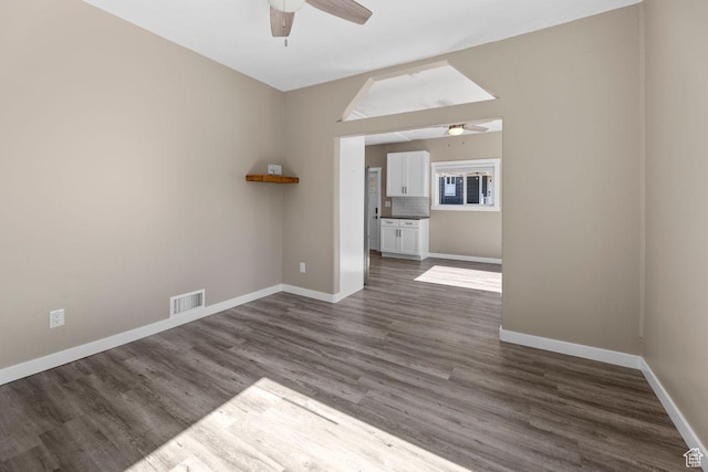 327 E Coatsville Ave S, Salt Lake City, UT 84115 - spare room with a ceiling fan, dark wood-style floors, and baseboards