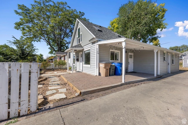 327 E Coatsville Ave S, Salt Lake City, UT 84115 - view of front of house with a patio and a shingled roof