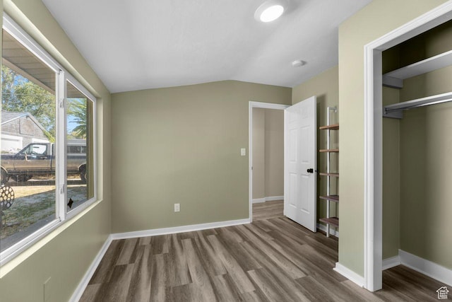 327 E Coatsville Ave S, Salt Lake City, UT 84115 - unfurnished bedroom with wood finished floors, baseboards, lofted ceiling, and a closet