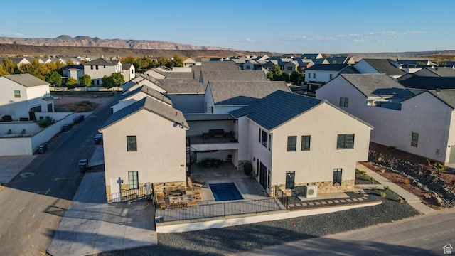 drone / aerial view featuring a mountain view and a residential view