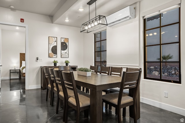 dining room with recessed lighting, finished concrete flooring, an AC wall unit, and baseboards