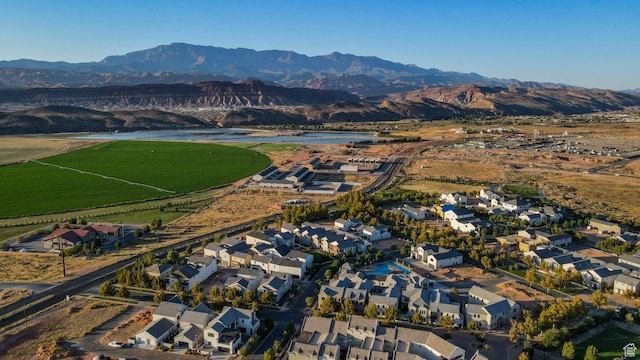 birds eye view of property with a water and mountain view and a residential view