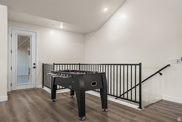 recreation room featuring recessed lighting, baseboards, and wood finished floors