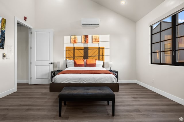 bedroom featuring a wall unit AC, wood finished floors, baseboards, and high vaulted ceiling