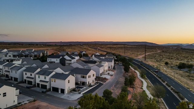 aerial view at dusk with a residential view and a mountain view