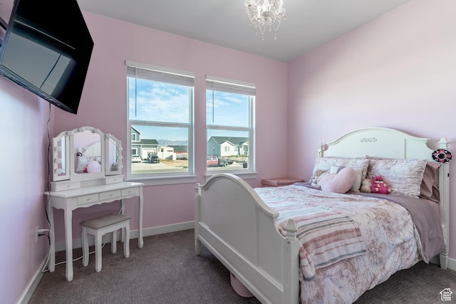 434 S Madeline Ct, Grantsville, UT 84029 - carpeted bedroom with an inviting chandelier and baseboards