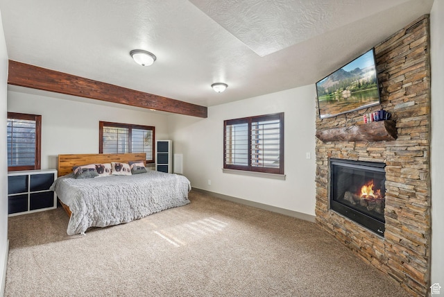 8938 N Canyon Wash Dr, Eagle Mountain, UT 84005 - bedroom with multiple windows, a fireplace, a textured ceiling, and beamed ceiling