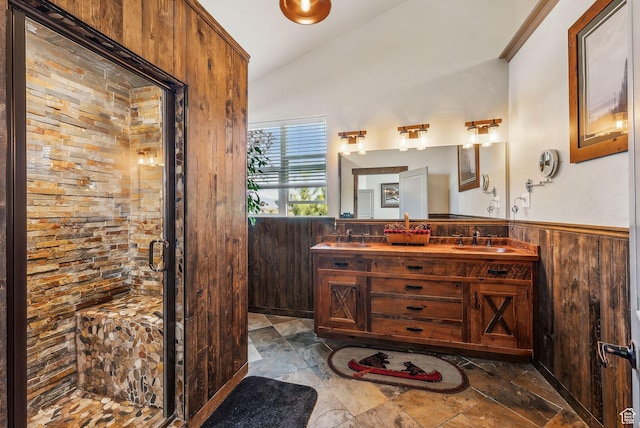 8938 N Canyon Wash Dr, Eagle Mountain, UT 84005 - full bath with lofted ceiling, wainscoting, a sink, and wooden walls
