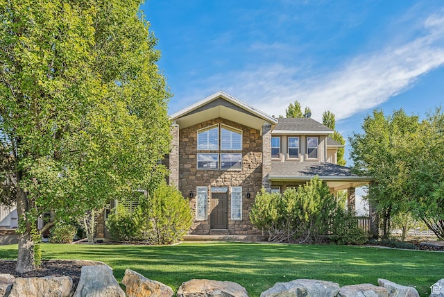 8938 N Canyon Wash Dr, Eagle Mountain, UT 84005 - view of front of house with stone siding and a front yard