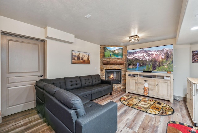 8938 N Canyon Wash Dr, Eagle Mountain, UT 84005 - living room with a stone fireplace and wood finished floors