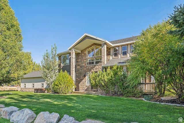 8938 N Canyon Wash Dr, Eagle Mountain, UT 84005 - view of front of home with stone siding and a front yard