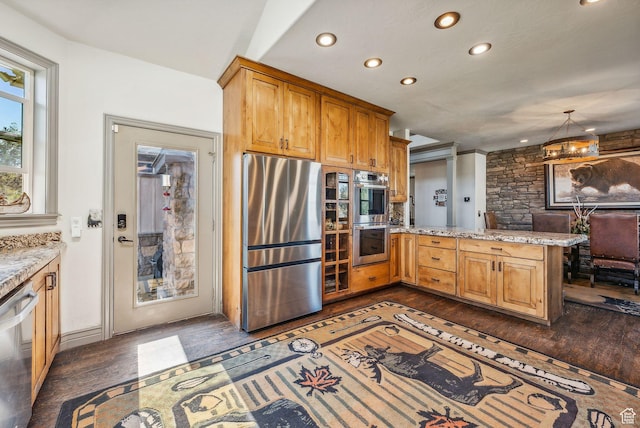 8938 N Canyon Wash Dr, Eagle Mountain, UT 84005 - kitchen featuring dark wood finished floors, appliances with stainless steel finishes, light stone counters, a peninsula, and recessed lighting