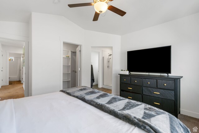 7152 N Brook Rdg, Eagle Mountain, UT 84005 - carpeted bedroom with a walk in closet, ceiling fan, a closet, and vaulted ceiling
