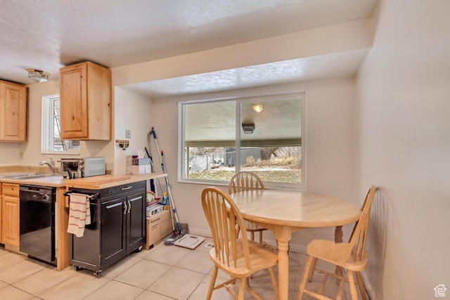 10551 Violet Dr, Sandy, UT 84094 - kitchen featuring dishwasher, light brown cabinetry, light tile patterned floors, light countertops, and a textured ceiling